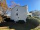Exterior view of two-story home features vinyl siding and trees, plus AC units at 138 Shady View Pl, Lawrenceville, GA 30044