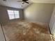 Large primary bedroom with a ceiling fan and lots of natural light from a window at 138 Shady View Pl, Lawrenceville, GA 30044