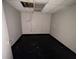 Room with tile floors, drop ceiling tiles with missing pieces, and peeling paint at 138 Shady View Pl, Lawrenceville, GA 30044