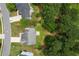 Birds eye view of the home and its neighborhood location, featuring mature trees and manicured lawns at 3025 Andora Sw Dr, Marietta, GA 30064