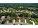 Aerial view of the community showcasing mature trees, well-manicured lawns, and neighborhood layout at 3025 Andora Sw Dr, Marietta, GA 30064