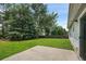 Well-maintained backyard with green lawn, patio, and mature trees for privacy at 3025 Andora Sw Dr, Marietta, GA 30064