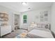Stylishly decorated bedroom with gray wood look floors, lots of light, and closet at 3025 Andora Sw Dr, Marietta, GA 30064