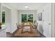 Bright dining area is staged with a table and chairs with a view to the backyard at 3025 Andora Sw Dr, Marietta, GA 30064