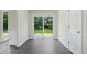 Bright dining area with hardwood floors and sliding glass doors to the backyard at 3025 Andora Sw Dr, Marietta, GA 30064
