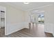 Open layout dining area with modern flooring, wainscoting detail, and abundant natural light at 3025 Andora Sw Dr, Marietta, GA 30064