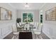 Formal dining room with modern decor, stylish furniture, and a bright window at 3025 Andora Sw Dr, Marietta, GA 30064