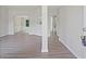 Open dining area with wainscoting detail, archway to another room and modern flooring at 3025 Andora Sw Dr, Marietta, GA 30064