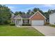 Charming single-story brick home with an attached garage and a well-maintained front yard at 3025 Andora Sw Dr, Marietta, GA 30064