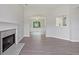 Open-concept living space with a fireplace, modern flooring, and neutral wall paint at 3025 Andora Sw Dr, Marietta, GA 30064