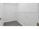 A simple walk-in closet with wire shelving and gray wood look floors at 3025 Andora Sw Dr, Marietta, GA 30064