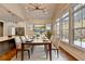 Dining area featuring a modern table, hardwood floors, and many windows at 3609 Centerville Rosebud Rd, Snellville, GA 30039