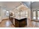Gourmet kitchen boasts an island with quartz countertops and pendant lighting at 3609 Centerville Rosebud Rd, Snellville, GA 30039