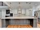 Kitchen features an island, stainless steel appliances, and custom cabinetry at 3609 Centerville Rosebud Rd, Snellville, GA 30039