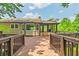 Features a home's backyard with a wooden deck and screened-in porch at 4655 Barnes Ct, Loganville, GA 30052