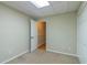 Finished basement area featuring neutral paint and carpet leading to a secondary room at 4655 Barnes Ct, Loganville, GA 30052