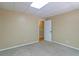 Finished basement area featuring neutral paint and carpet leading to a secondary room at 4655 Barnes Ct, Loganville, GA 30052