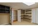 Basement area with tile flooring, shelving, and storage at 4655 Barnes Ct, Loganville, GA 30052