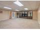 Basement featuring carpeted floors and a large display cabinet at 4655 Barnes Ct, Loganville, GA 30052