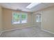 Finished bedroom area featuring neutral paint and carpet and a window for natural light at 4655 Barnes Ct, Loganville, GA 30052