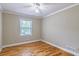 Bedroom with hardwood flooring and a bright window to the backyard at 4655 Barnes Ct, Loganville, GA 30052