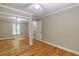 Bedroom features hardwood flooring and a closet with mirrored sliding doors at 4655 Barnes Ct, Loganville, GA 30052