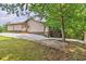Exterior of a home with a driveway, lawn, and outdoor deck at 4655 Barnes Ct, Loganville, GA 30052