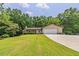 View of the front exterior of a single Gathering home on a grassy lot at 4655 Barnes Ct, Loganville, GA 30052