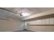 Garage area featuring sealed concrete floors and lots of overhead cabinet storage at 4655 Barnes Ct, Loganville, GA 30052