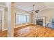 Bright living room with hardwood floors, bay window, and fireplace, creating a cozy atmosphere at 4655 Barnes Ct, Loganville, GA 30052