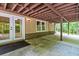 Covered outdoor patio with double doors and a window at 4655 Barnes Ct, Loganville, GA 30052