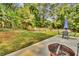 Spacious backyard featuring a patio with outdoor furniture and a playset at 4794 Glenbonnie Ct, Atlanta, GA 30360