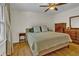 Bedroom with hard wood floors, ceiling fan and furniture at 4794 Glenbonnie Ct, Atlanta, GA 30360