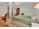 Bedroom with a neutral color scheme, carpeted floors, and a desk and bookcase at 4794 Glenbonnie Ct, Atlanta, GA 30360