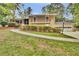 Well-maintained home featuring manicured landscaping, a covered porch, and an attached two-car garage at 4794 Glenbonnie Ct, Atlanta, GA 30360
