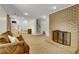 Spacious living room with a brick fireplace, carpeted floor, and a brown sofa at 4794 Glenbonnie Ct, Atlanta, GA 30360
