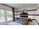 A stylish bedroom featuring modern decor, a large window, and custom black and white accents at 4820 Gadwall Way, Cumming, GA 30028