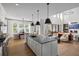 Gourmet kitchen with a large island, modern appliances, and seamless flow into the adjacent living area at 4820 Gadwall Way, Cumming, GA 30028