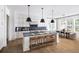 Modern kitchen with a large island, sleek countertops, and stainless steel appliances, perfect for entertaining at 4820 Gadwall Way, Cumming, GA 30028