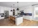 Spacious kitchen featuring a large island, modern appliances, and ample cabinet space for storage and convenience at 4820 Gadwall Way, Cumming, GA 30028