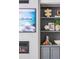 Close-up of stylish built-in shelves and fireplace, showcasing decor and modern design elements at 4820 Gadwall Way, Cumming, GA 30028