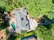 This home's backyard features a fire pit, mature landscaping, and a patio adjacent to the in-ground pool at 511 Pine Valley Se Rd, Marietta, GA 30067