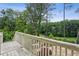 View of the lush green backyard and landscaped steps from the deck at 511 Pine Valley Se Rd, Marietta, GA 30067