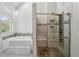 Spa-like bathroom featuring a large soaking tub and a frameless glass shower at 511 Pine Valley Se Rd, Marietta, GA 30067