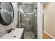 Bathroom boasts a tiled walk-in shower and modern vanity at 511 Pine Valley Se Rd, Marietta, GA 30067