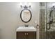 Bathroom boasts an updated vanity, lighting, mirror, and tiled shower at 511 Pine Valley Se Rd, Marietta, GA 30067