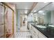 Traditional bathroom with dual sinks, vanity, and shower at 511 Pine Valley Se Rd, Marietta, GA 30067