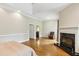 This bedroom has hardwood floors, a fireplace, and neutral paint colors at 511 Pine Valley Se Rd, Marietta, GA 30067
