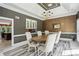 Elegant dining room with modern chandelier and large table for entertaining at 511 Pine Valley Se Rd, Marietta, GA 30067