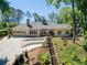 Stunning ranch-style home featuring a well-manicured lawn, attached garage and an extra long, private driveway at 511 Pine Valley Se Rd, Marietta, GA 30067